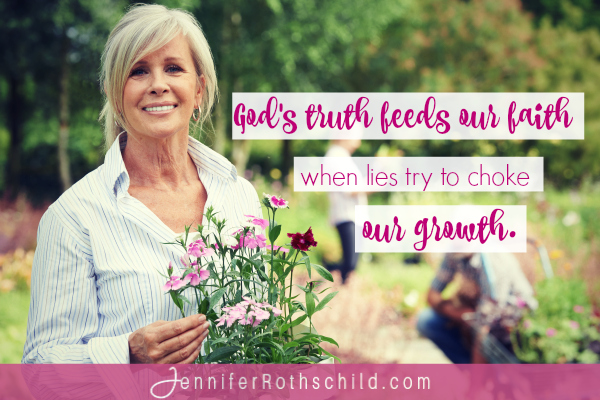 Mature Woman Choosing Plants At Garden Center